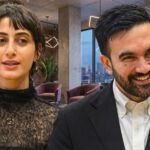 Socialist Mayor SIDELINES NYPD — Chaos Looming? Two professionals engaged in conversation in a modern office setting