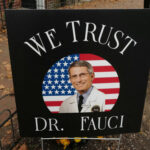 Sign reading We Trust Dr. Fauci on display.