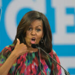 Election CHAOS Unveiled: Skid Row Bribery EXPOSED A woman speaking passionately at an event.