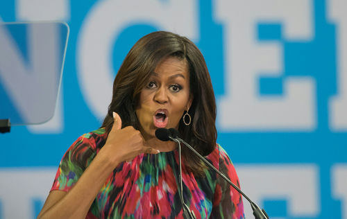 A woman speaking passionately at an event.