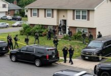 SWATTING ATTACK On Justice Amy Coney Barrett Was Far From A Prank… Law enforcement officers conducting a raid in a residential neighborhood
