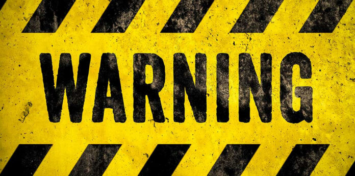 1196537179 Warning sign with yellow and black stripes.