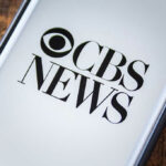 CBS Meltdown: 60 Minutes Legend Axed Phone screen showing CBS News logo.