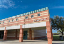 Fired Over Kissing Skits—Back Teaching Kids Exterior of an elementary school building.