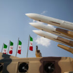 Airport Inferno Blamed On Iran Missiles displayed with Iranian flags in the background
