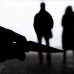 Congresswoman Downplays Murder Weapon — Fury Erupts Silhouette of a person holding a knife with two figures in the background