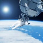 Space Station Leak Triggers Dragon Dash An astronaut performing a spacewalk above Earth