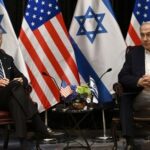 Rubio Hails ‘First Step’ — Bombs Still Fly Two political leaders seated with flags in the background