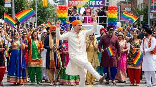Justin,Trudeau,Dancing,At,A,Pride,Parade Participants in traditional attire celebrating at a Pride parade