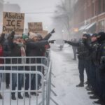 Kids Turned Into Protest Props? Protesters holding signs against ICE in a snowy environment