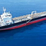 Tankers Hit — U.S. Strikes Slam Iran Oil tanker ship sailing on calm blue sea