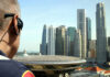 Security personnel overlooking a city skyline with modern skyscrapers