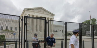 Security officials at the Supreme Court gates.
