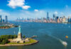 Statue of Liberty with New York City skyline background.