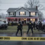 Fake Deeds, Real Evictions — Outrage Mounts FBI agents at a crime scene outside a house with police vehicles and caution tape
