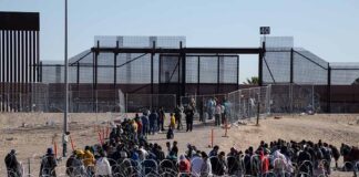 People waiting in line at border gate 40.